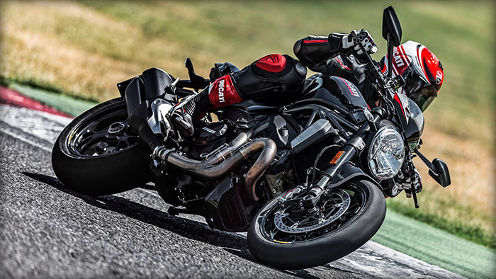 Black Ducati Monster 1200 R in action
