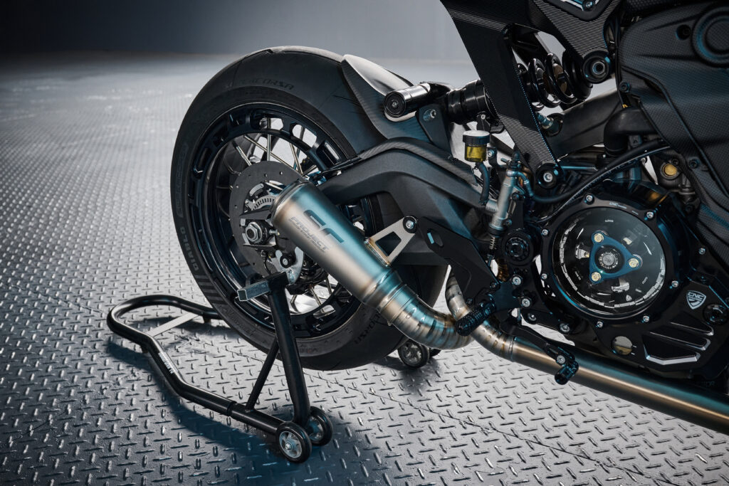 Detailed shot of the custom titanium exhaust system and carbon fiber trim of the custom Ducati Monster 937 Silhouette R by Rough Crafts
